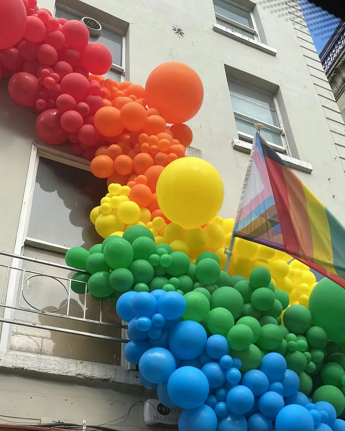 A rainbow garland for a shop front