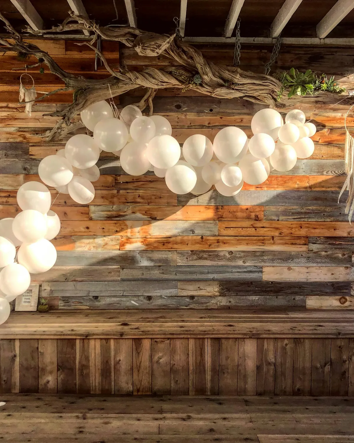A white garland for a barn wedding