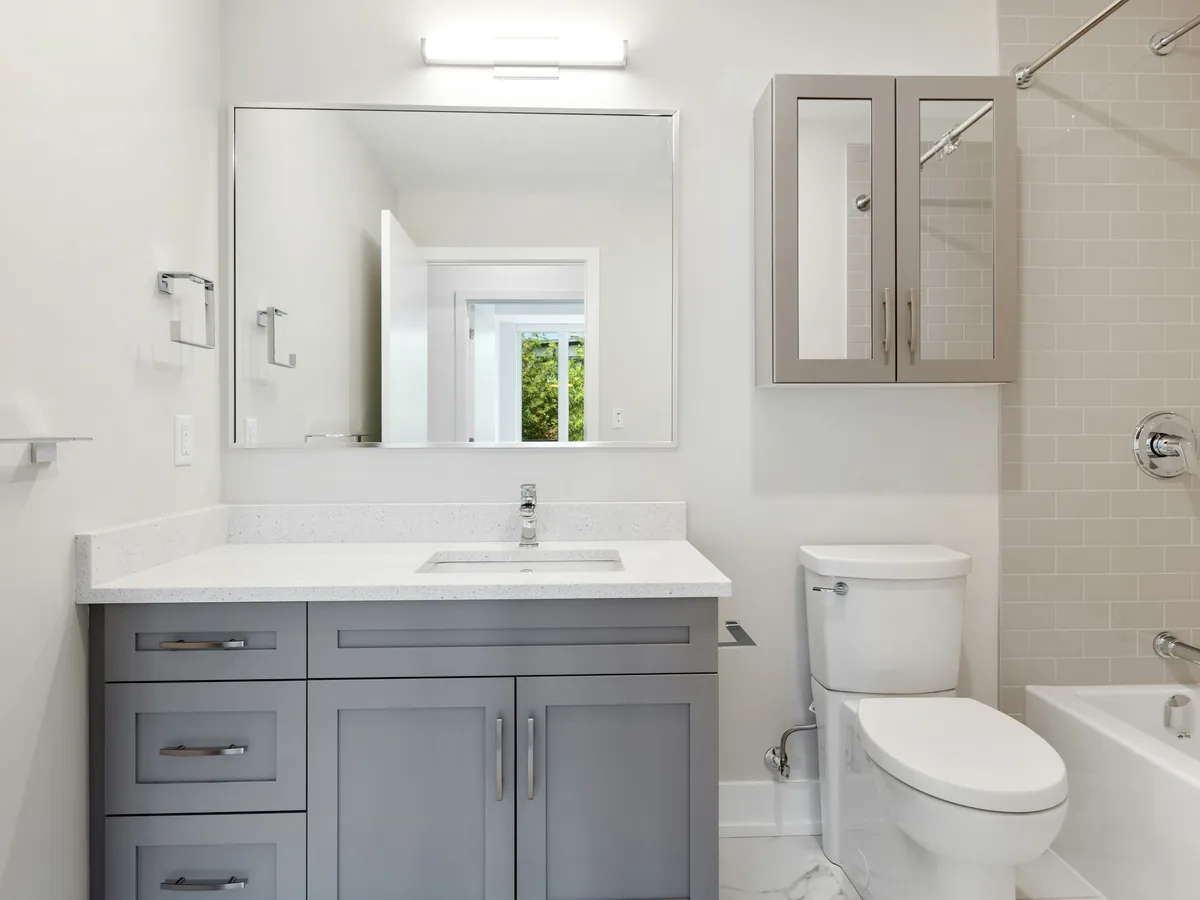Bathroom vanity and mirror fitted